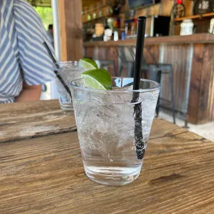 a glass of ice and lime