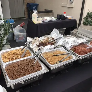 Chicken, Carne Asada, Carnitas, Grilled Onions, Beans, Rice, and Cheese Quesadillas for the kids. Richard does it all!