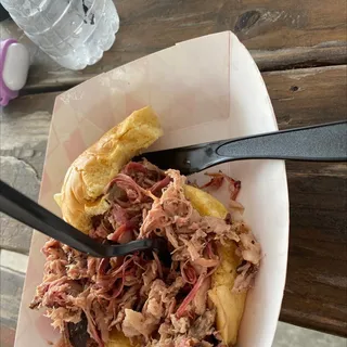 Pulled Pork Sandwich with House Sauce and Vinegar Slaw