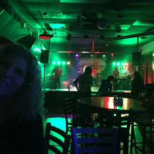 a group of people in a dimly lit room