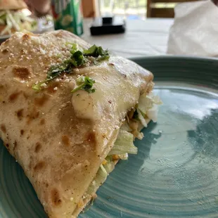 Half of the carnitas burrito. Very good and very large.