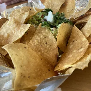 Nachos with freshly made guacamole.