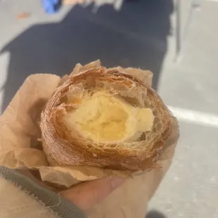 Enjoying a cream horn* whilst selling olives. *Not a market item, but from a bakery in South San Francisco.