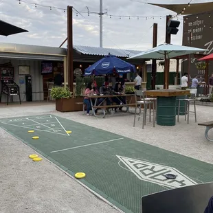 a man sitting at a table outside