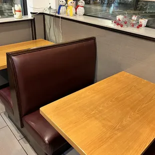 a table and booths in a restaurant