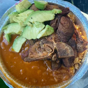 Fried pork chop rice beans and avocado