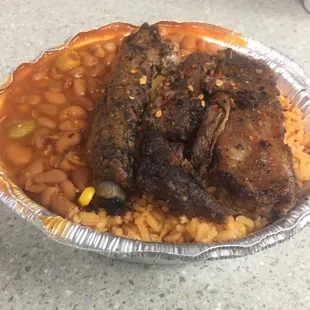 Ribs with yellow rice, beans, and hot seeds (upon request) - $7 small platter