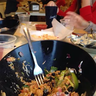 a bowl of food with a fork in it