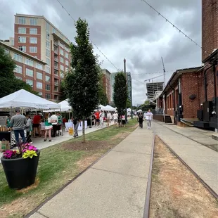 people walking down the sidewalk