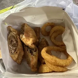 Jerk chicken egg rolls with onion rings. It looks small but, it&apos;s a very generous portion.