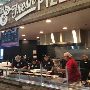 ows customers preparing food