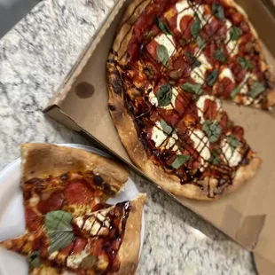 Margarita pizza - with pepperoni and sausage with a drizzle of balsamic.