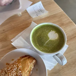 Spinach-feta croissant and matcha latte with strawberry milk