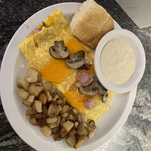 Ham Mushrooms and cheddar, home fried and biscuit and homemade cream gravy