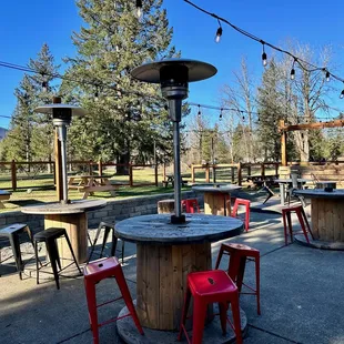 a patio with tables and chairs