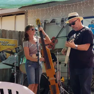 a man and a woman playing instruments