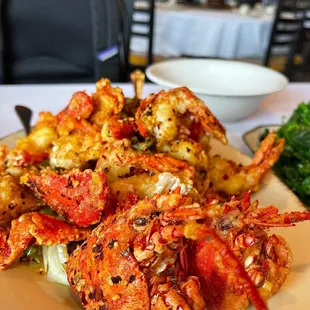 a plate of shrimp and broccoli