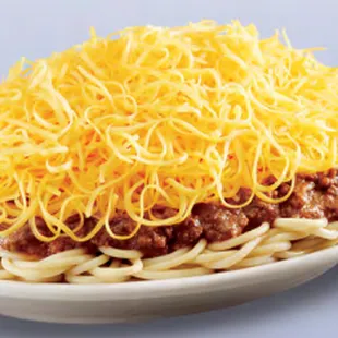 a plate of spaghetti topped with cheese