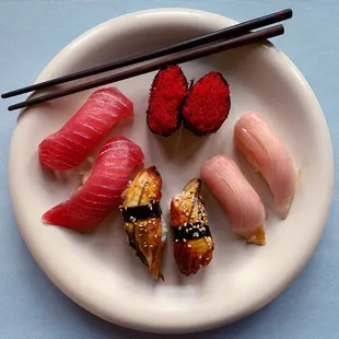 tobiko (red flying fish roe), hamachi, unagi (fresh water eel), maguro.