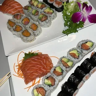 Top plate has 2pc salmon nigiri, Spicy Yellowtail Roll, Salmon Avocado Roll, and Salmon Roll