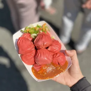 a person holding a plate of food