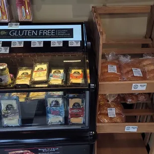 Cooler of cheese and a stand with buns