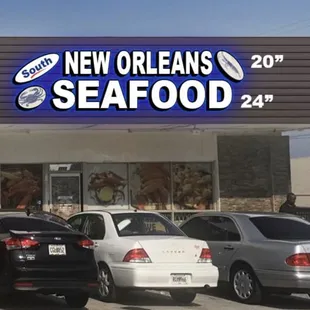 cars parked in front of a restaurant