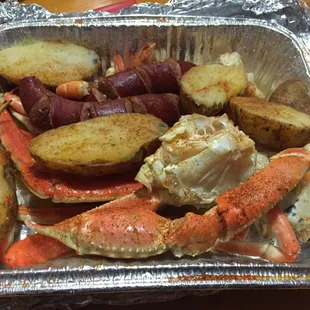 2 crab legs, 1/4 lb of shrimp, 3 potatoes, and 2 sausages = $28