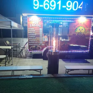 a taco truck parked in front of a restaurant