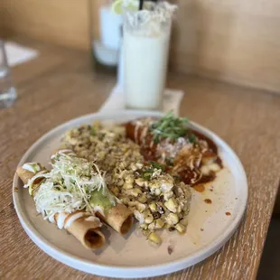 Potato Taquitos and Cheese Enchilada combination with Tijuana Street Corn