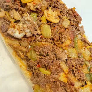 Pizza Philly add mushrooms,green pepper,and banana peppers