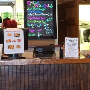 Daily lunch specials. Helluva deal. They come with a huge thing of fresh cut fries and a drink.