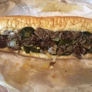 Pepper steak with jalapeño peppers and provolone cheese