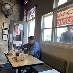 a man sitting at a table eating
