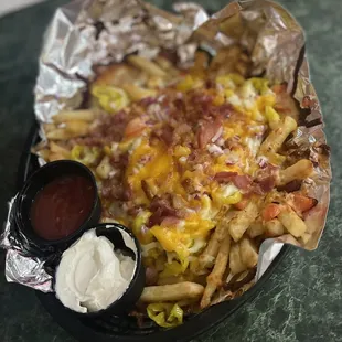 a loaded plate of fries