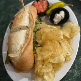 a sandwich and chips on a plate