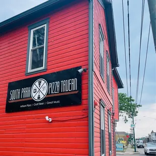 a red building with a clock on it