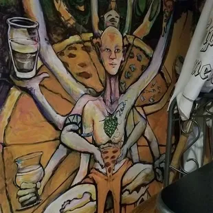 a mural of a woman holding a cup of coffee