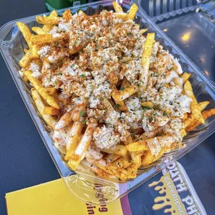Crab fries! French fries with melted American cheese, fresh blue crab and old bay!