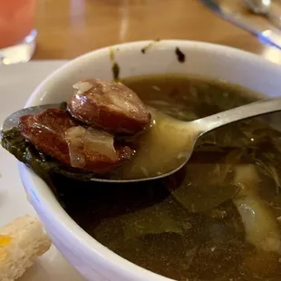 a bowl of soup and a sandwich