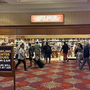 people walking through the store