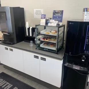 Lounge area, coffee, water and Donuts.