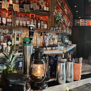 a bar with a lot of bottles of alcohol