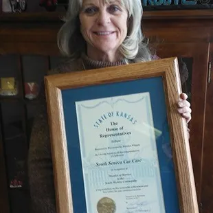 Coleen&apos;s award from the House of Representatives for a decade of service.