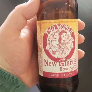 a person holding a beer bottle