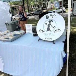 a woman standing under a tent