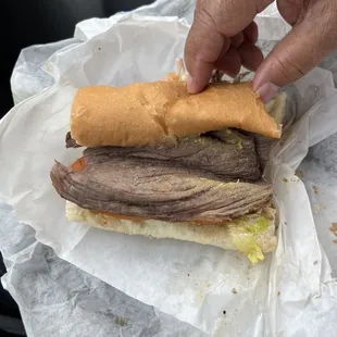 Roast Beef (see the cut) not against the grain. The bread is Awesome!