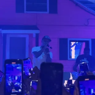 a group of people holding up their cell phones