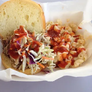 Pulled pork sandwich with Mac n cheese. Plus the hot sauce for a little sum sum