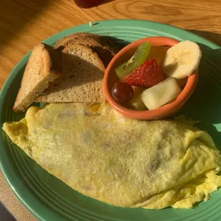 Southside Special. Omelette with green chillies, bacon, and cheese. GF toast and fresh fruit.